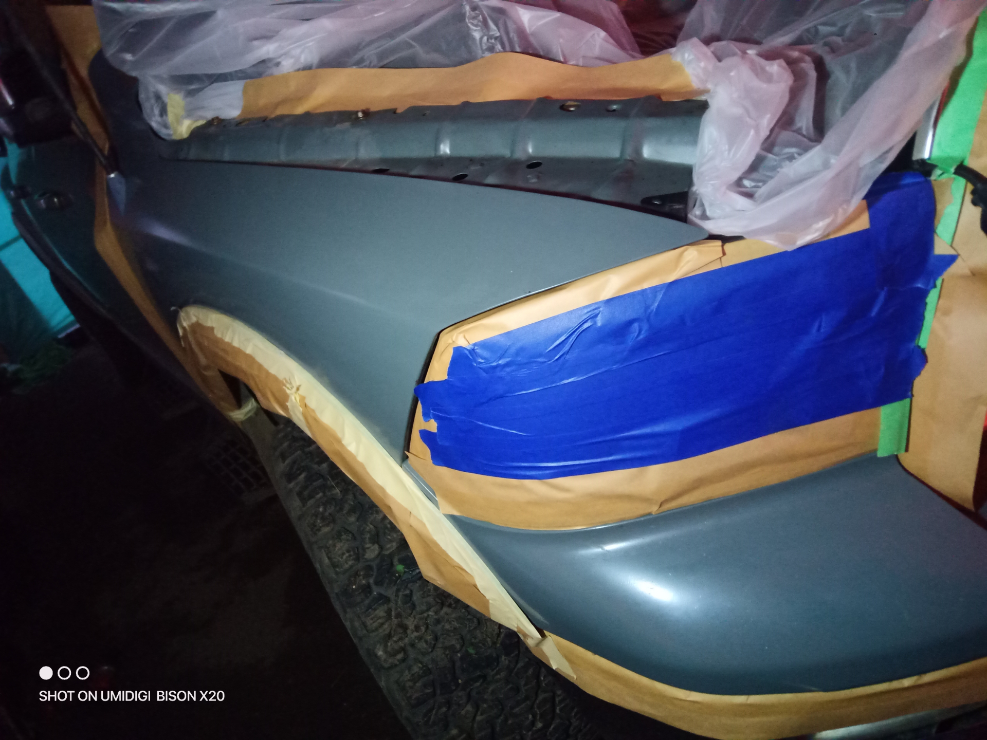 Fender masked and primed, ready for paint