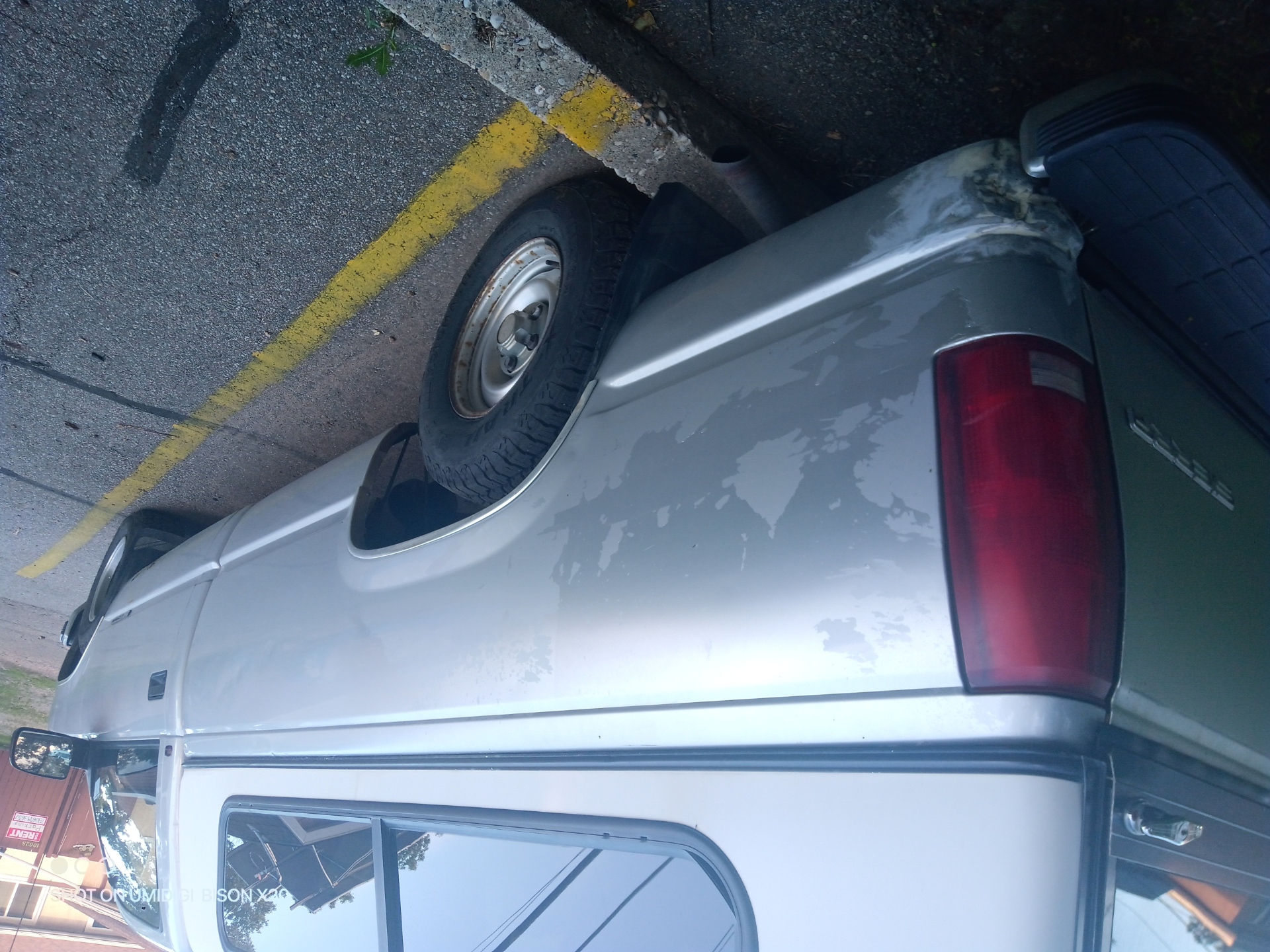 Rear angle of the GMC project truck with canopy